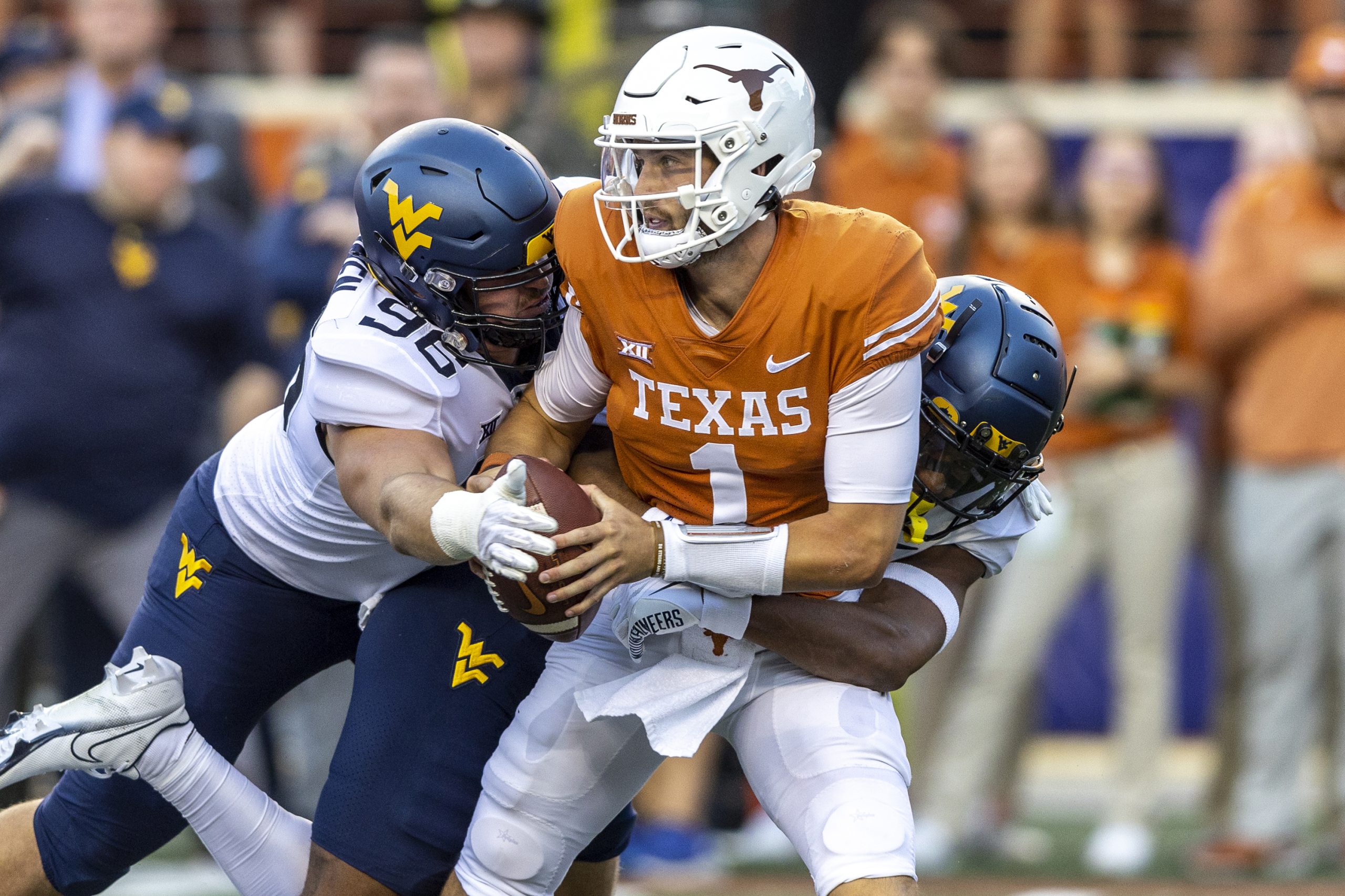 Hudson Card leads Texas to 38-20 victory against  West Virginia with 303 yards, three TDs